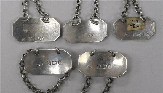 Five George III and later octagonal silver sauce labels;